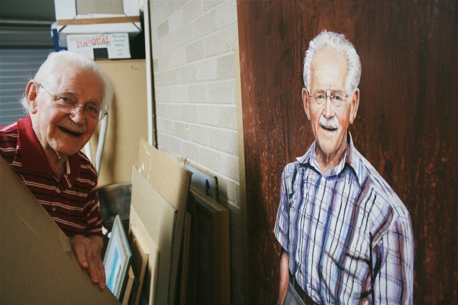 Phillip posing adjacent to his life-size portrait (painted prior to his stroke)